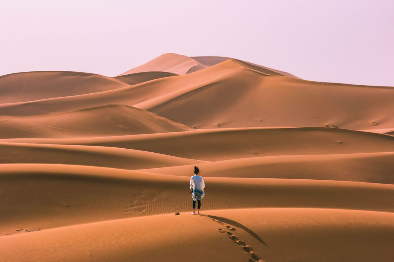 Erg Chigaga desert camp surrounded by Sahara dunes